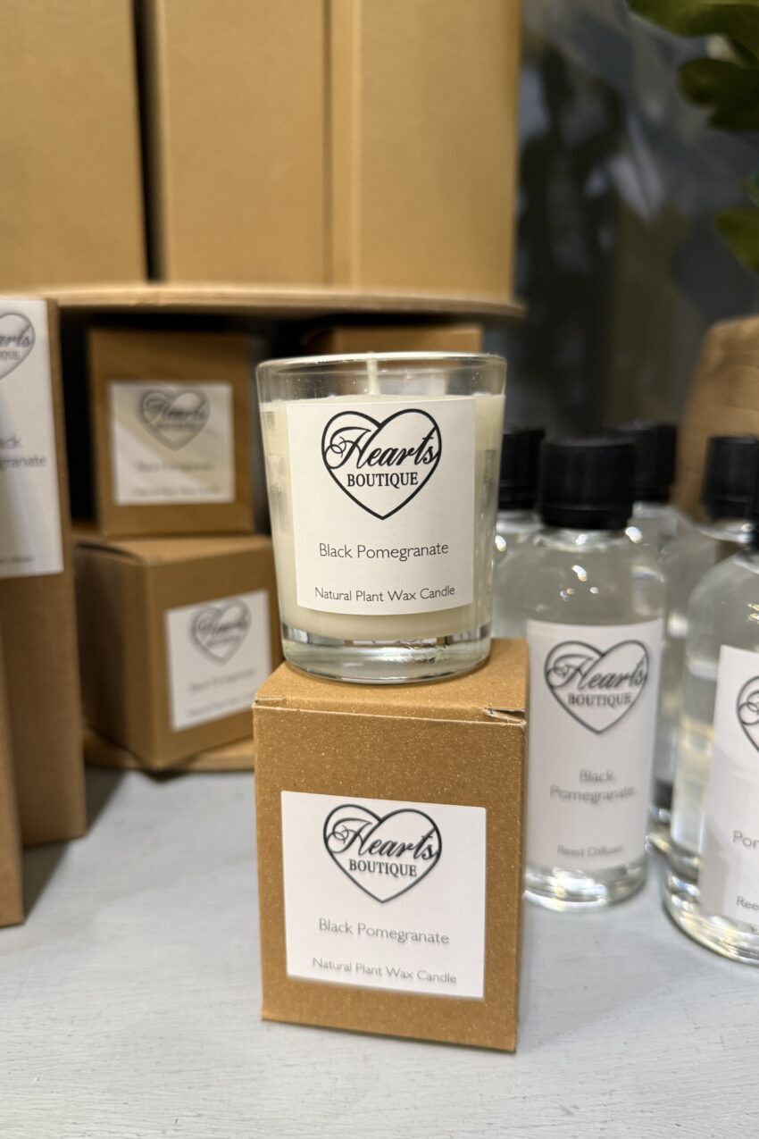 Black Pomegranate Candle Small on display.
