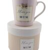 Pink striped mug with gold accents reads I love you mum. Placed onto of display box.