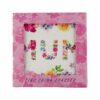 Image of ceramic coaster with Mum design written in flowers. In pink cardboard packaging.