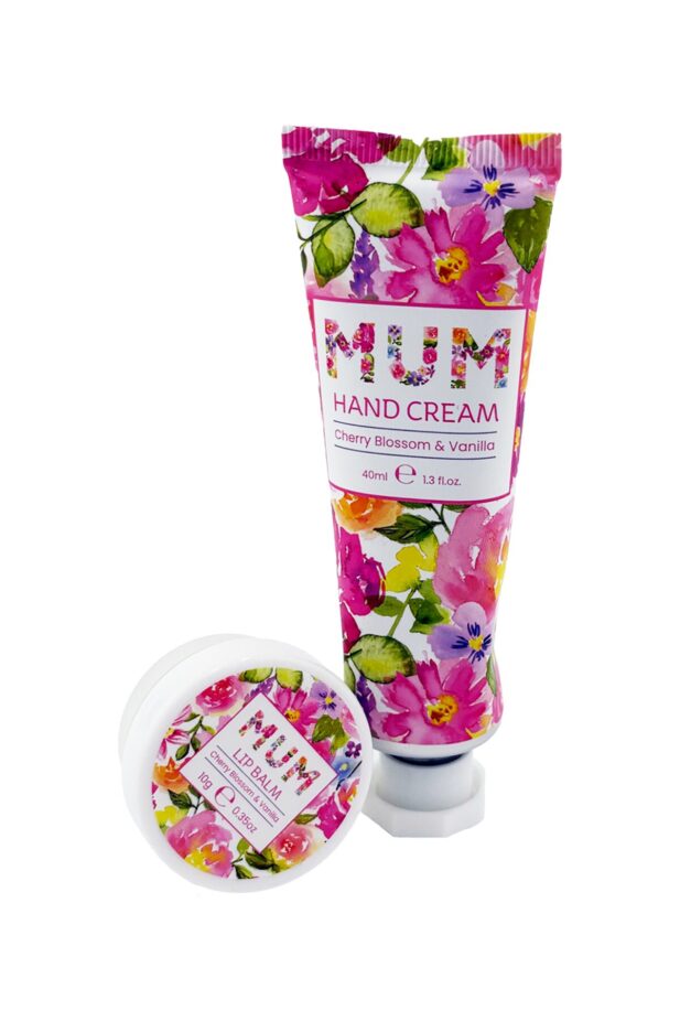 Pink floral hand cream, reads Mum in floral design alongside round container of lip balm.