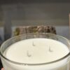 Three wick candle upclose image.